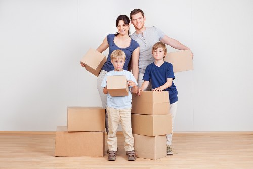 Commercial relocation setup with desks, boxes, and moving equipment