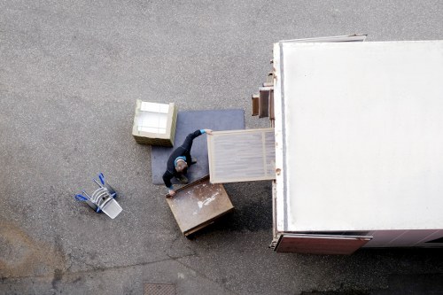 Business relocation service setting up desks and office equipment