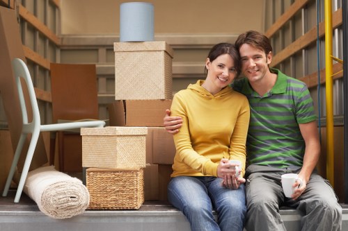 Van loading scene showing trained movers securing furniture safely