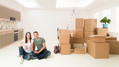 Local office moving team handling furniture and boxes near Coneyhall