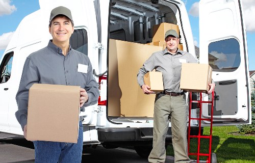 Packed boxes and furniture ready for a house move in Coneyhall