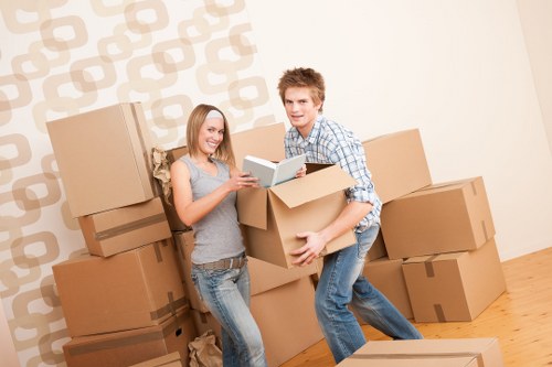 Local moving team loading furniture into a van in Coneyhall