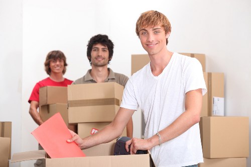 Local moving van loading household items in Coneyhall