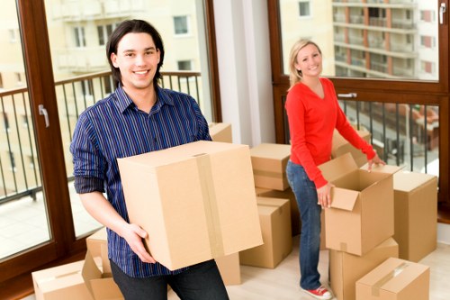 Moving team preparing furniture and boxes for transport in Coneyhall